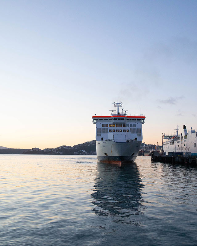 An Interislander ferry at dawn in Wellington Harbour