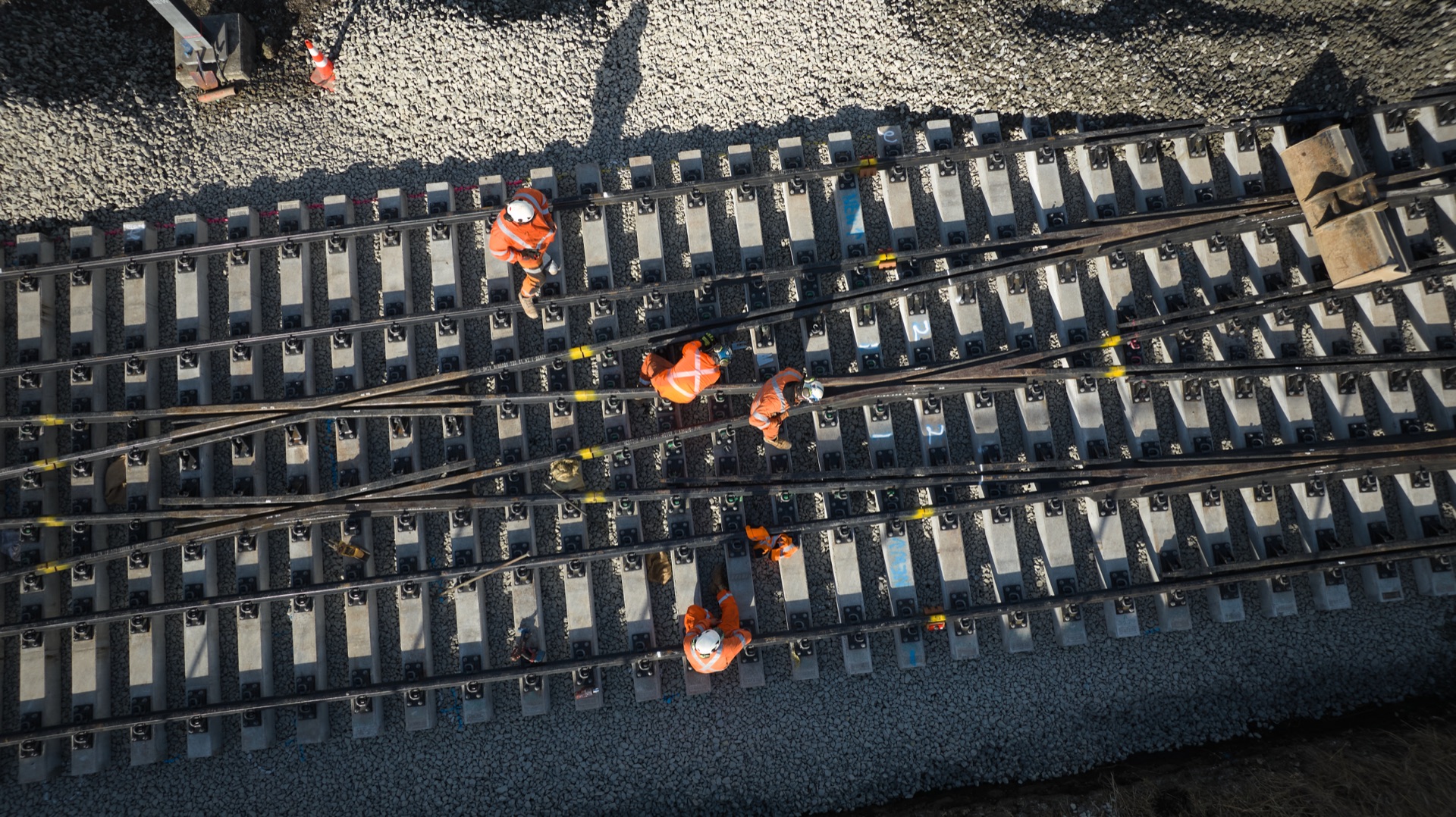 Aerial view of KiwiRail track crews working between converging rails